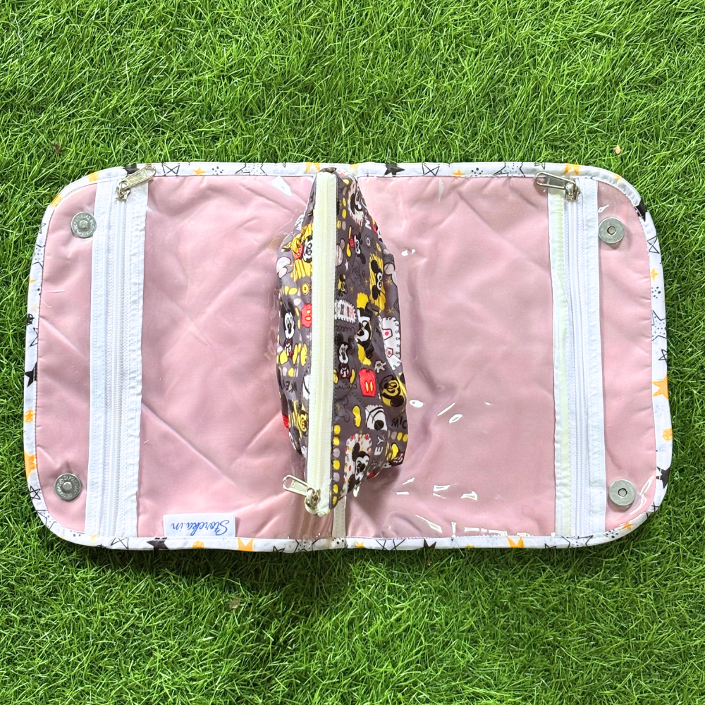 Pink pouch with a colorful strap