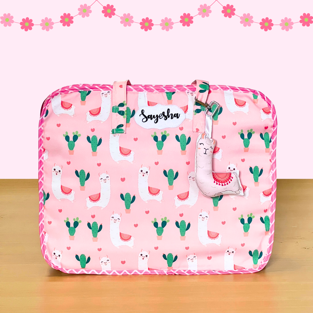 Pink pouch with llama and cactus pattern