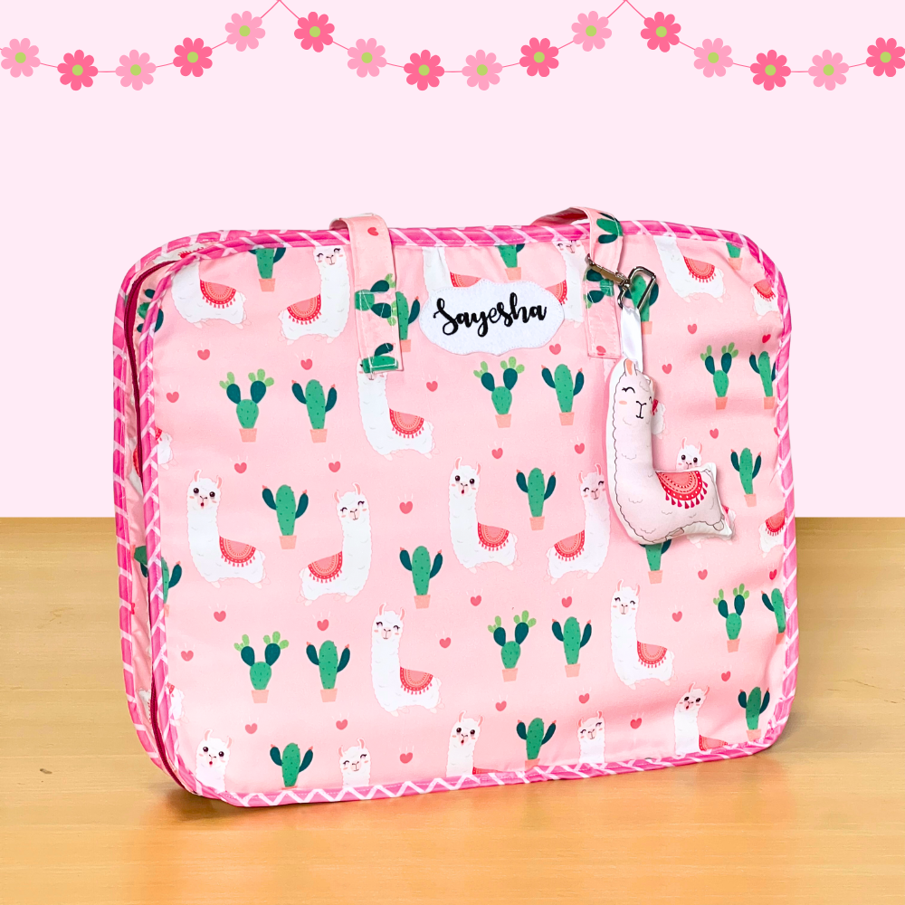 Pink suitcase with llama