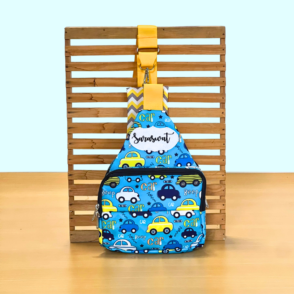 Blue sling bag with car pattern
