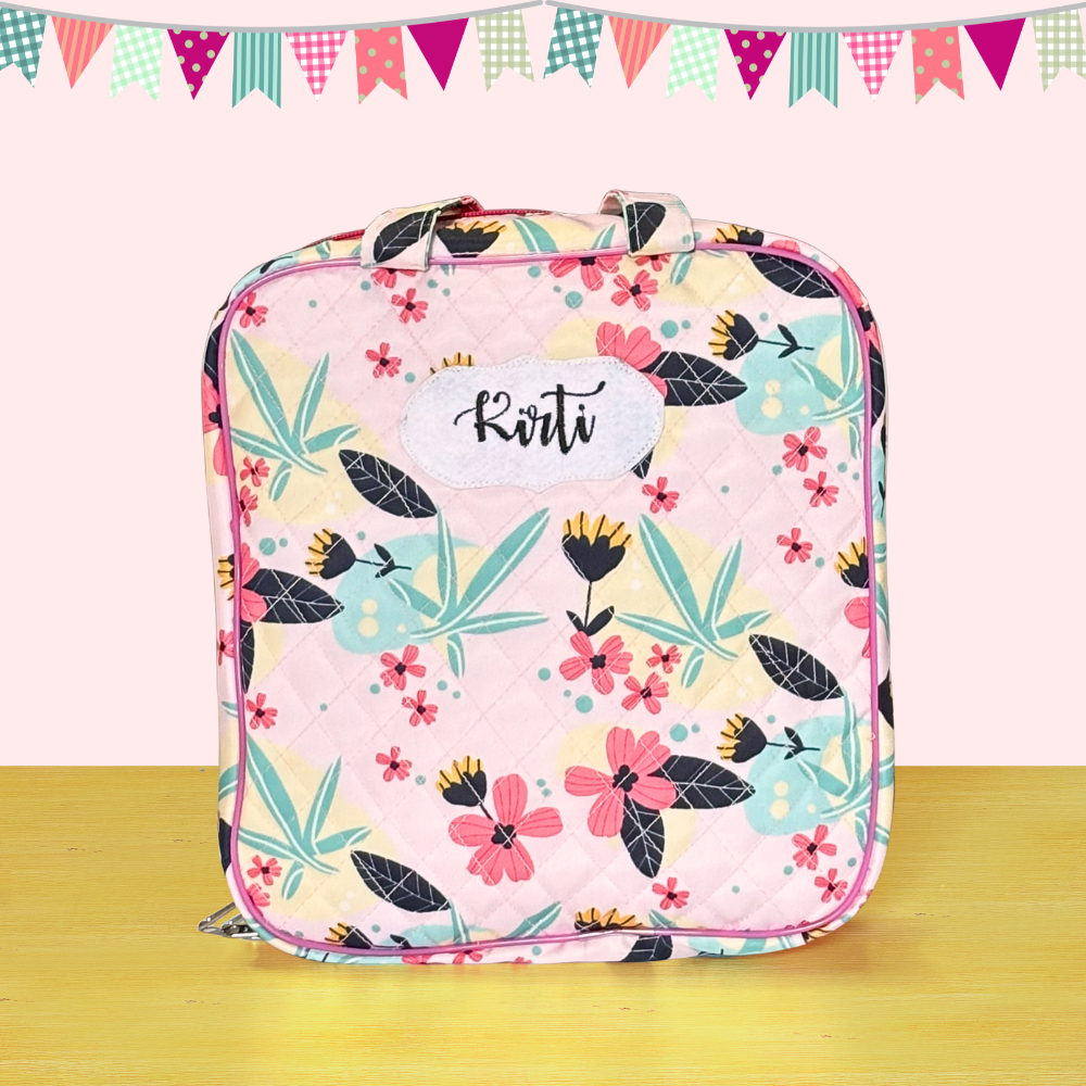 Floral-patterned bag with 'Kivi' branding