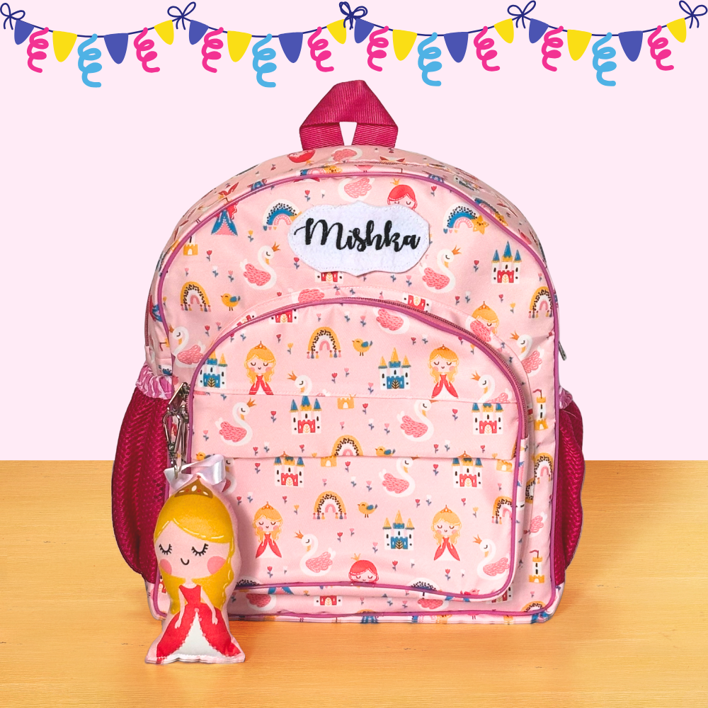 Pink children's backpack with colorful patterns and a matching keychain