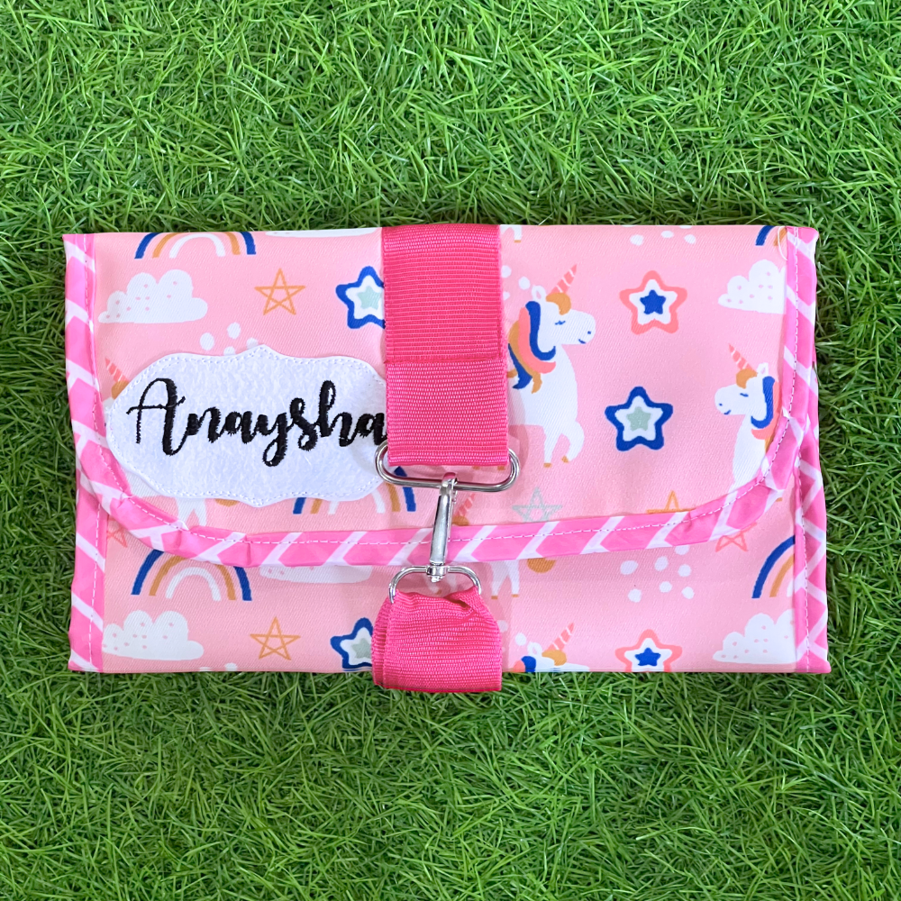 Pink pouch with unicorn pattern