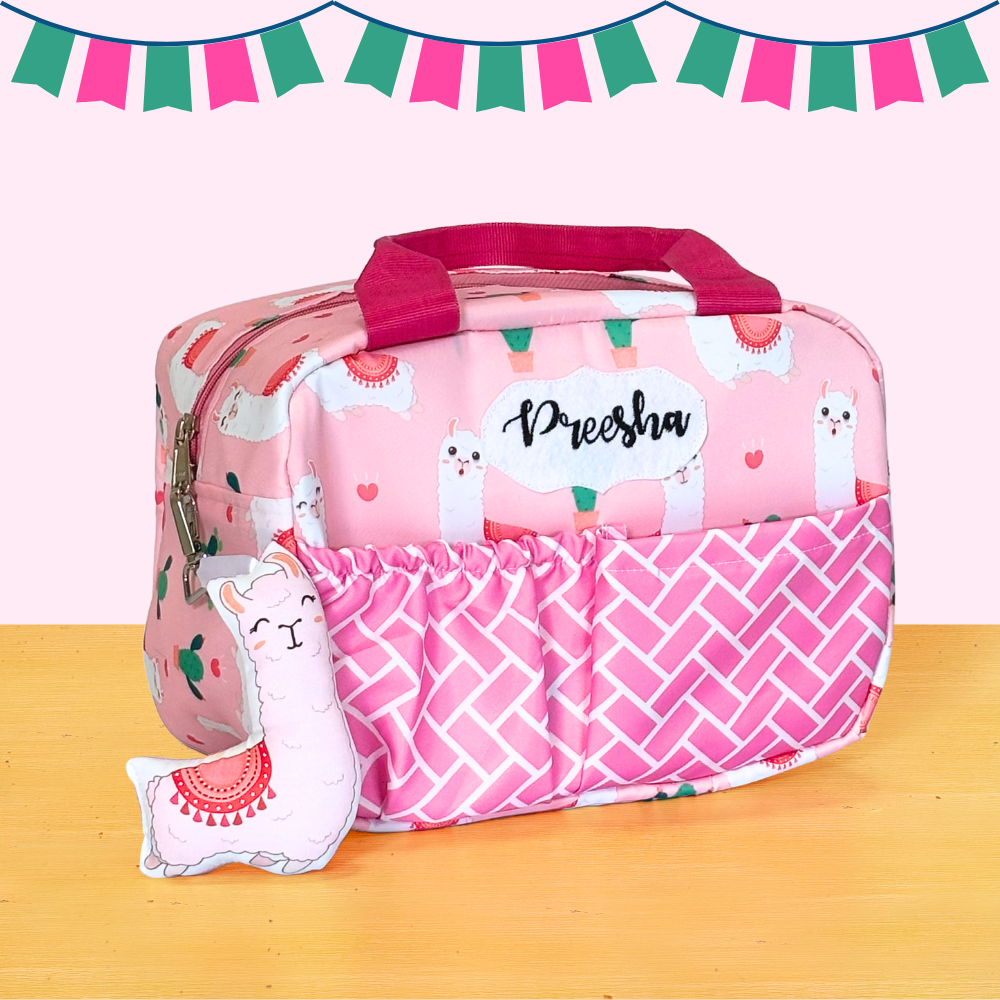 Pink lunch bag with llama design and 'Preeish