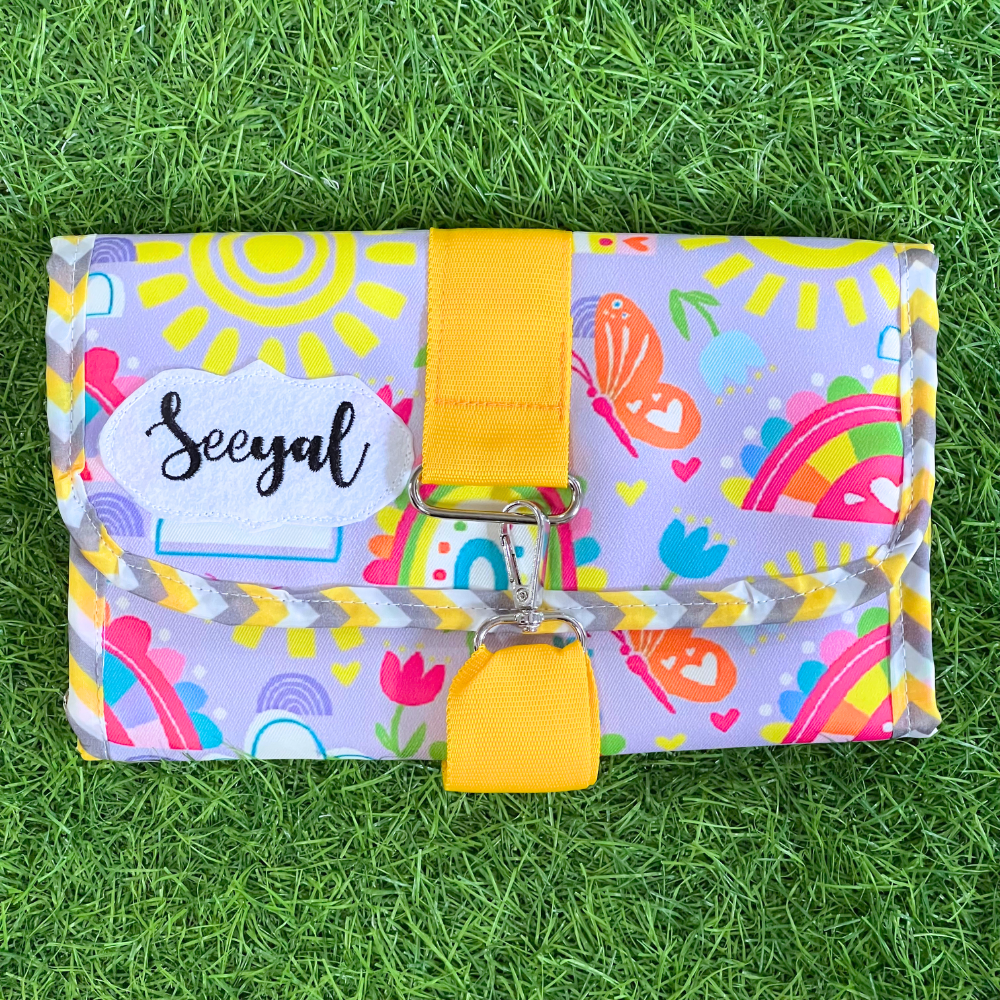 Colorful pouch with a yellow strap
