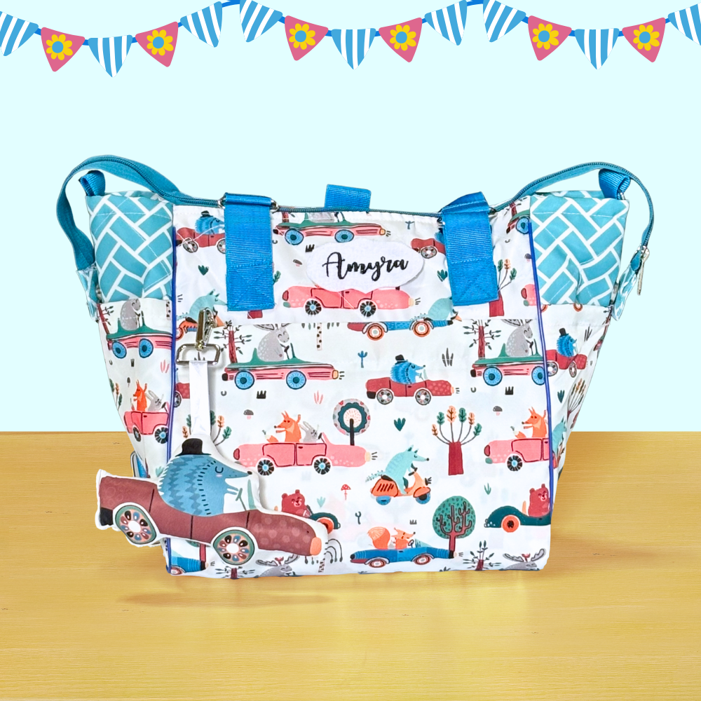 Patterned bag with blue handles