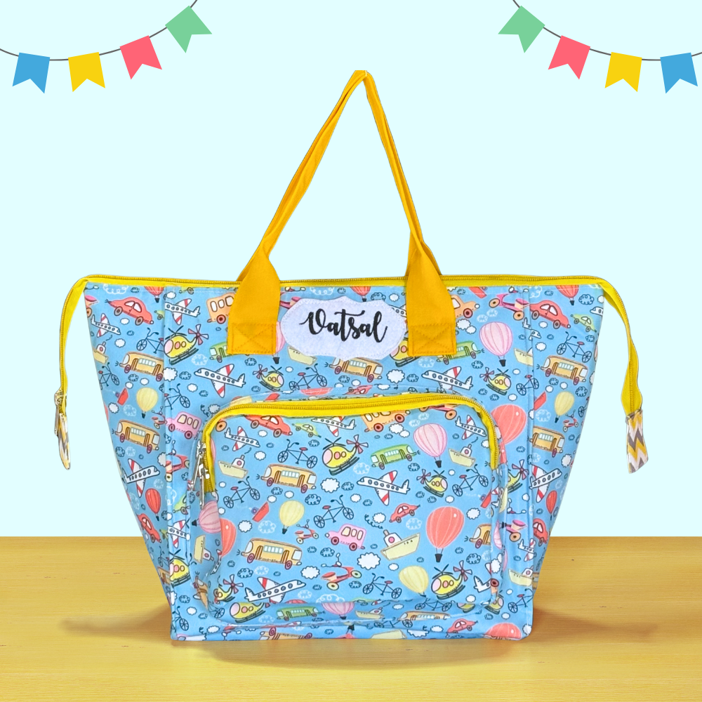 Blue bag with yellow handles and a cartoon pattern