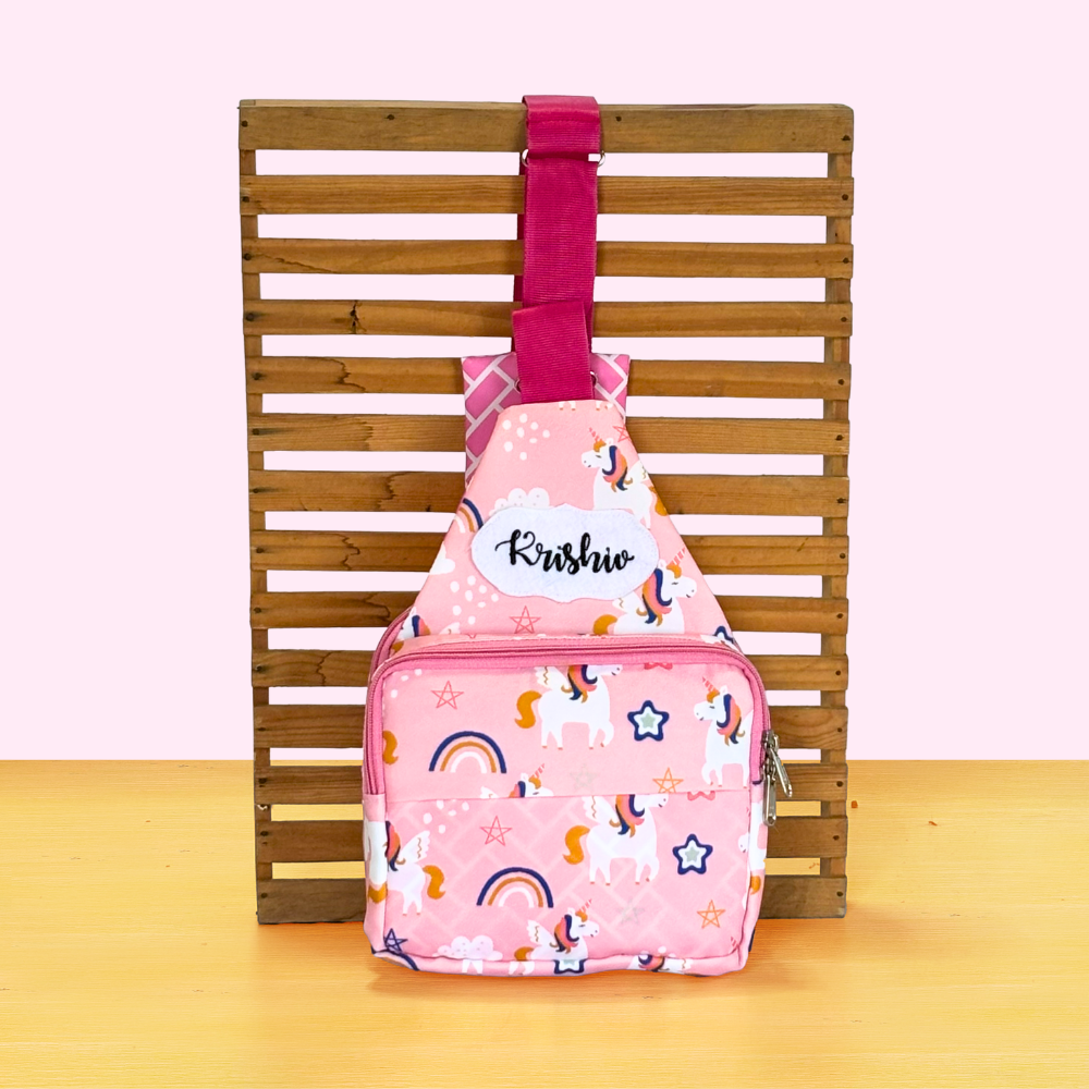 Pink backpack with unicorn pattern
