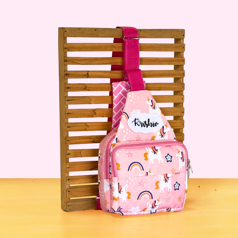 Pink sling bag with rainbow and star pattern