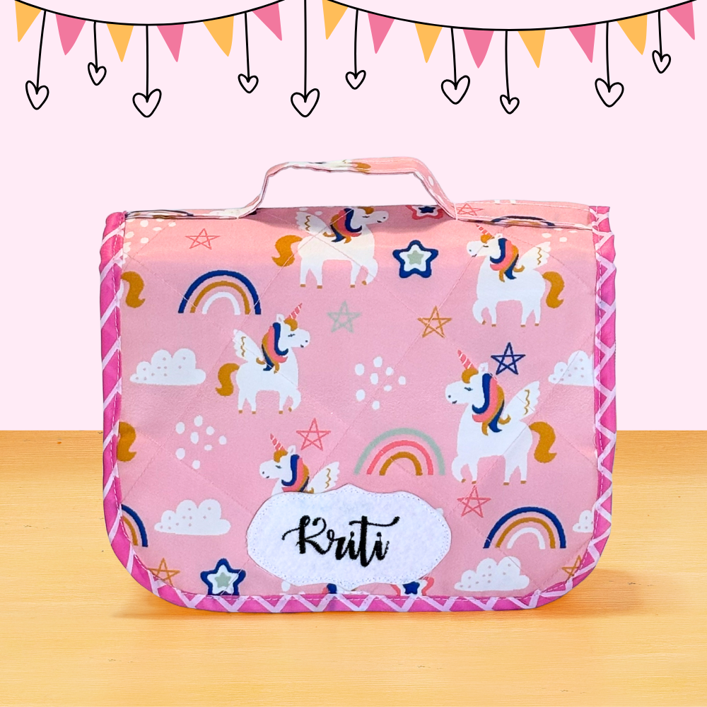 Pink pouch with unicorn pattern