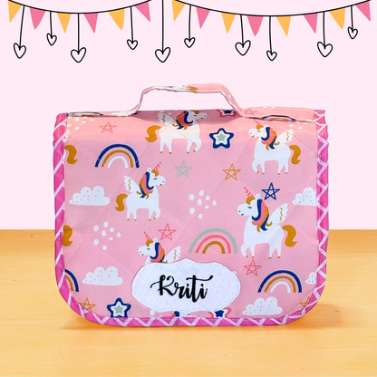 Pink pouch with unicorn pattern
