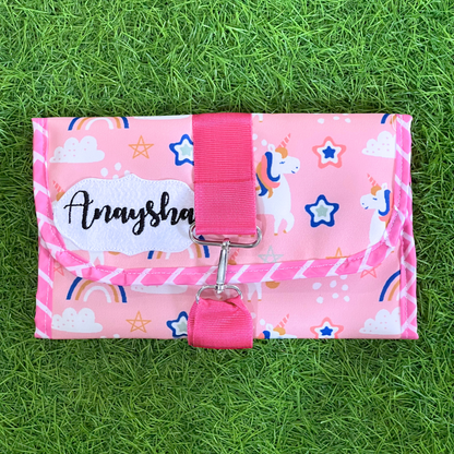 Pink pouch with unicorn pattern 