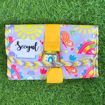 Colorful pouch with a yellow strap