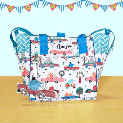 Patterned bag with blue handles