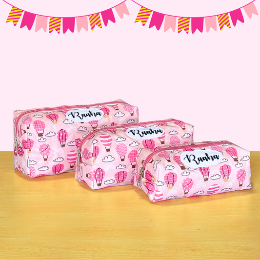 Three pink pencil cases