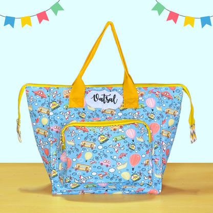 Blue bag with yellow handles and a cartoon pattern