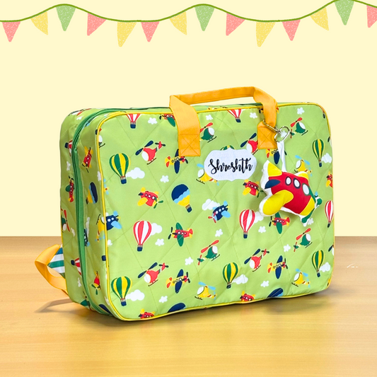 Green suitcase with colorful 