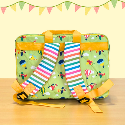 Green suitcase with colorful airplane pattern